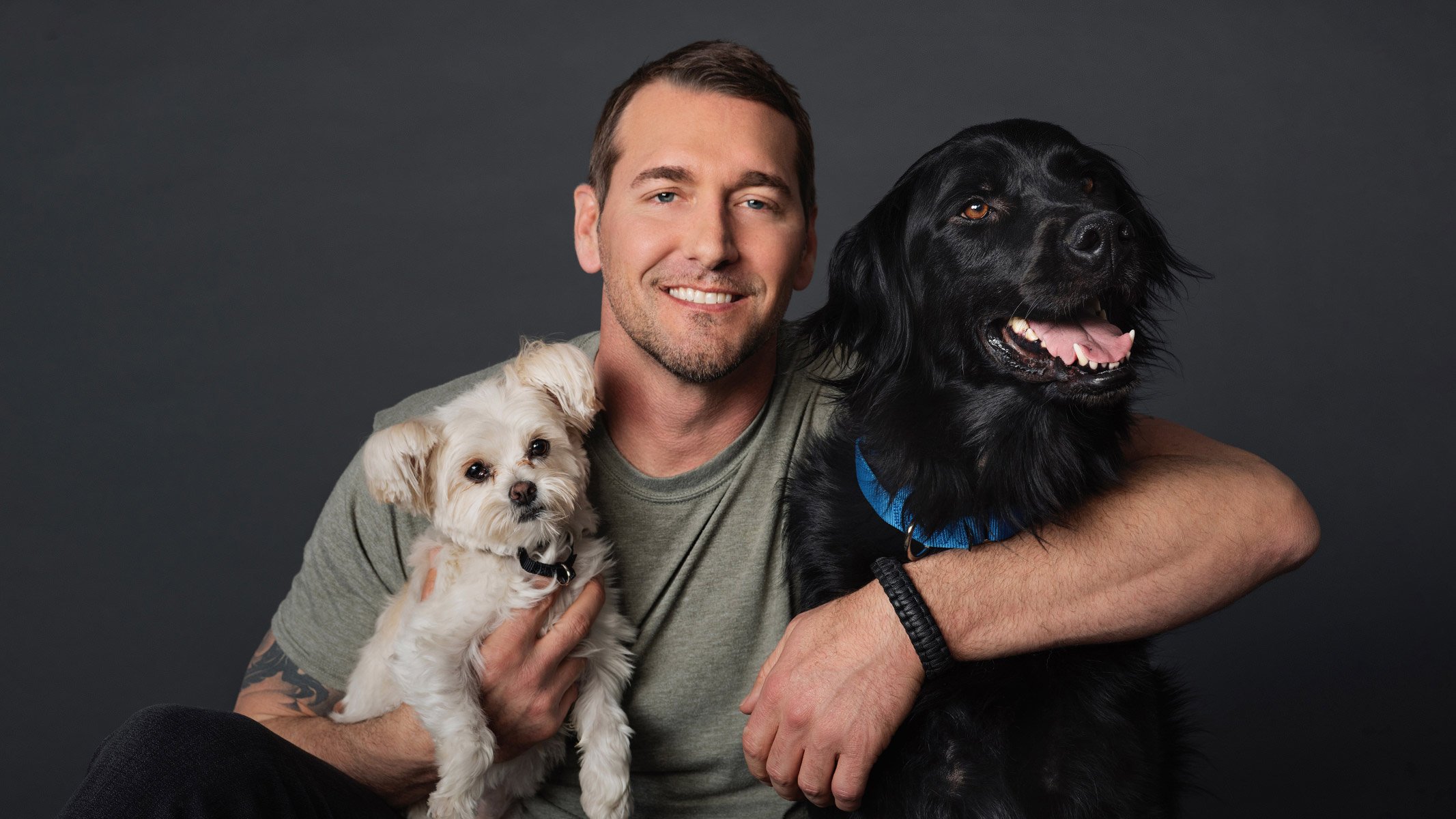 Brandon McMillan — professional portrait with two dogs